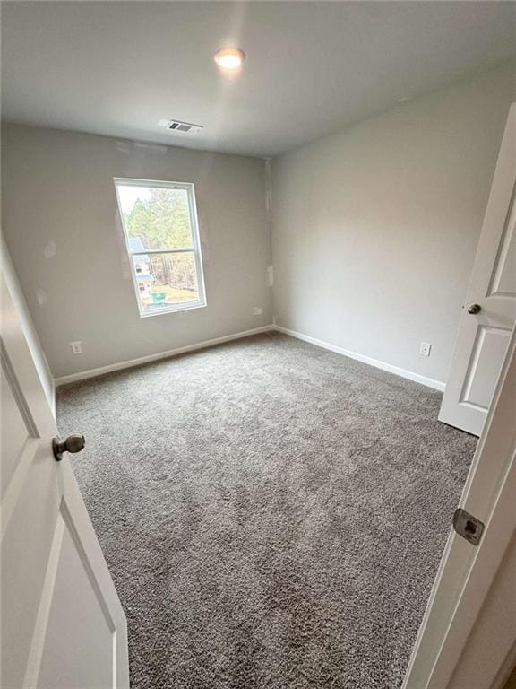 45 Emerald Ln, Covington, GA 30014 - carpeted empty room featuring baseboards