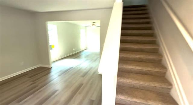 45 Emerald Ln, Covington, GA 30014 - stairway featuring wood finished floors and baseboards