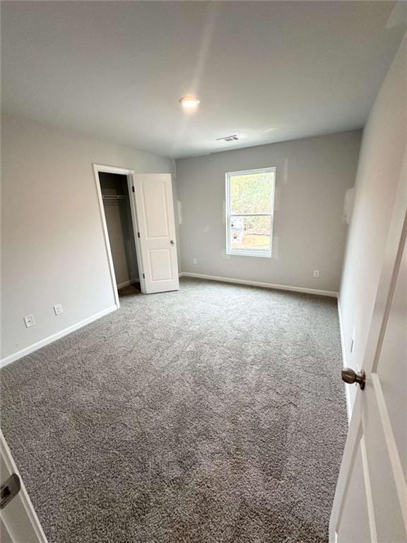 45 Emerald Ln, Covington, GA 30014 - unfurnished bedroom with carpet and baseboards