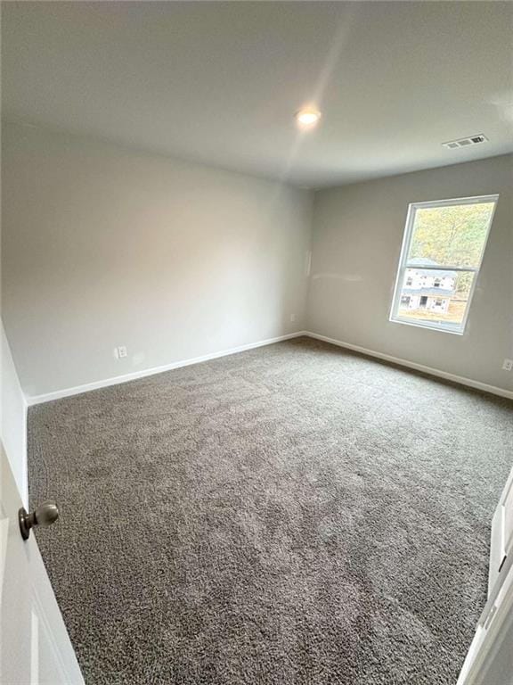 45 Emerald Ln, Covington, GA 30014 - empty room featuring carpet floors and baseboards