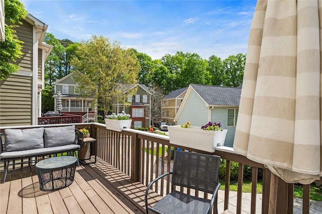 wooden deck with a residential view