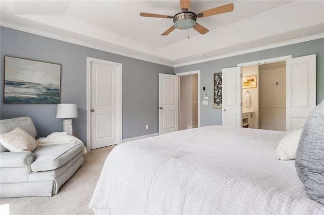 bedroom featuring carpet floors, a raised ceiling, and crown molding