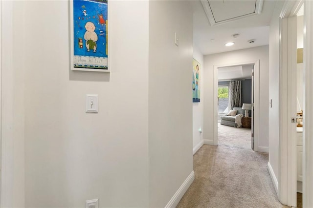 corridor with baseboards, attic access, carpet, and recessed lighting