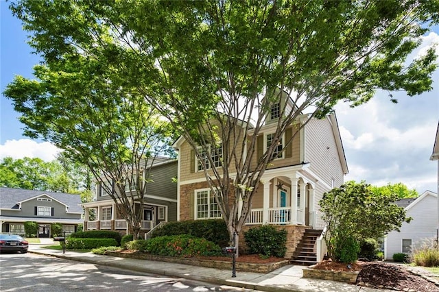 view of front of home featuring a porch and stairs