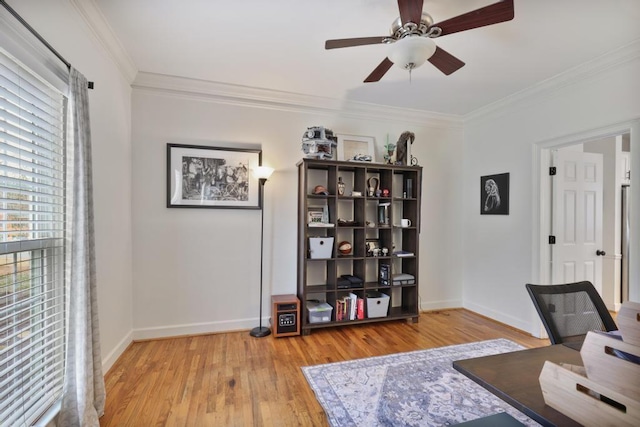 home office with a ceiling fan, crown molding, wood finished floors, and baseboards