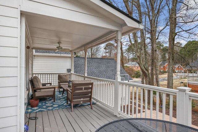 wooden terrace with a ceiling fan