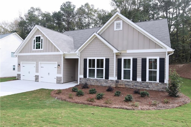 craftsman-style house featuring a front yard and a garage