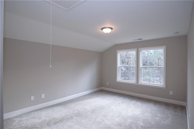 additional living space with lofted ceiling and carpet flooring