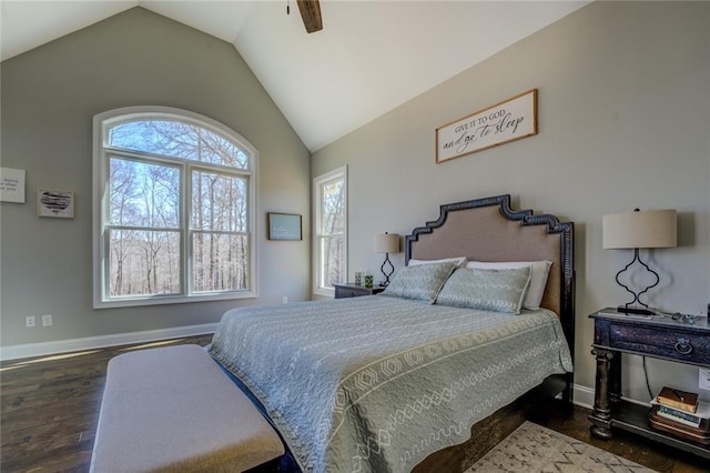 bedroom featuring dark wood finished floors, baseboards, lofted ceiling, and a ceiling fan