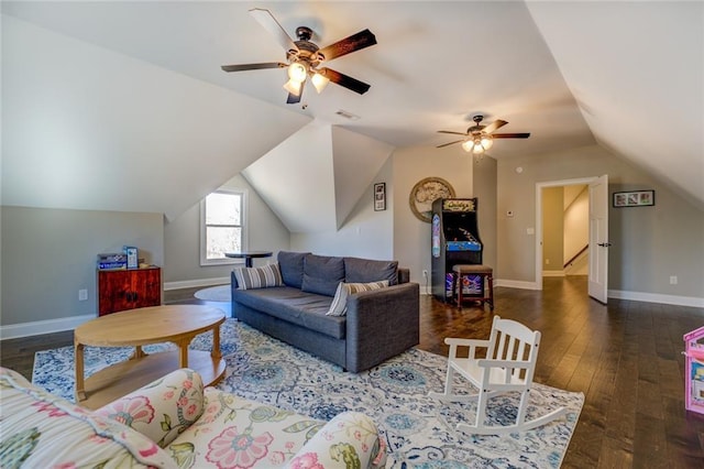 living area featuring baseboards, visible vents, lofted ceiling, ceiling fan, and wood-type flooring