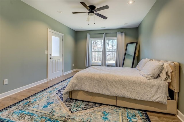 bedroom featuring recessed lighting, wood finished floors, baseboards, and ceiling fan