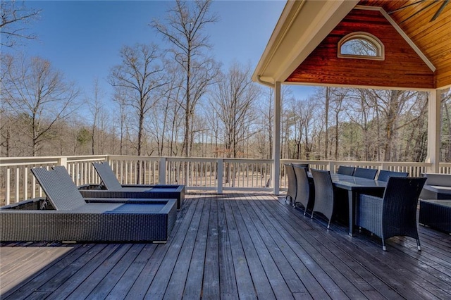 wooden terrace with outdoor lounge area and outdoor dining area