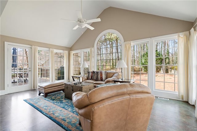 sunroom with vaulted ceiling, visible vents, and ceiling fan