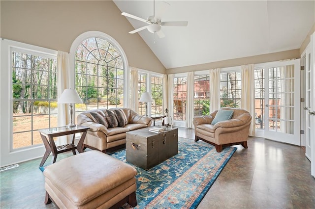 sunroom / solarium featuring a ceiling fan, lofted ceiling, french doors, and visible vents