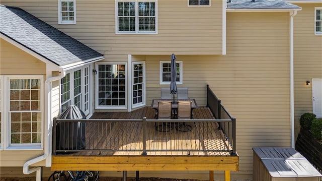 wooden terrace with outdoor dining space