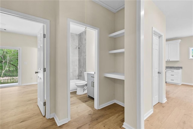 5232 W Mountain St, Stone Mountain, GA 30083 - hallway with light wood-type flooring, attic access, and built in features