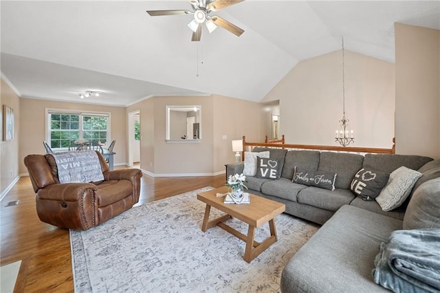 173 Cline Smith Rd NE, Cartersville, GA 30121 - living area with wood finished floors, a chandelier, ceiling fan, and vaulted ceiling