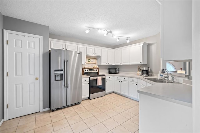 173 Cline Smith Rd NE, Cartersville, GA 30121 - kitchen with appliances with stainless steel finishes, white cabinetry, light countertops, light tile patterned flooring, and a textured ceiling