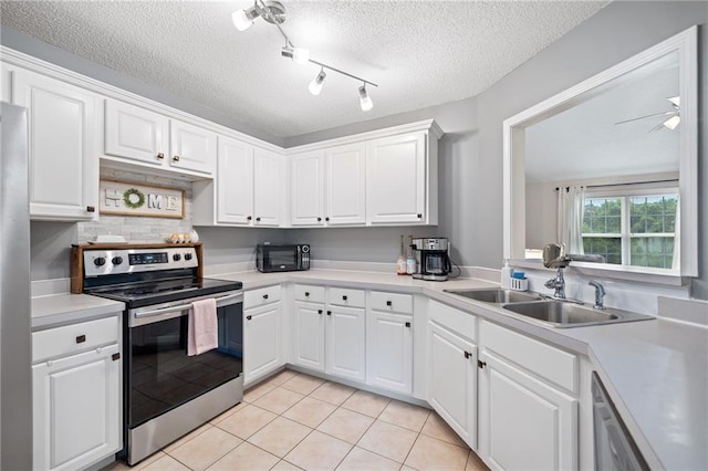 173 Cline Smith Rd NE, Cartersville, GA 30121 - kitchen with stainless steel appliances, light countertops, white cabinetry, and a textured ceiling