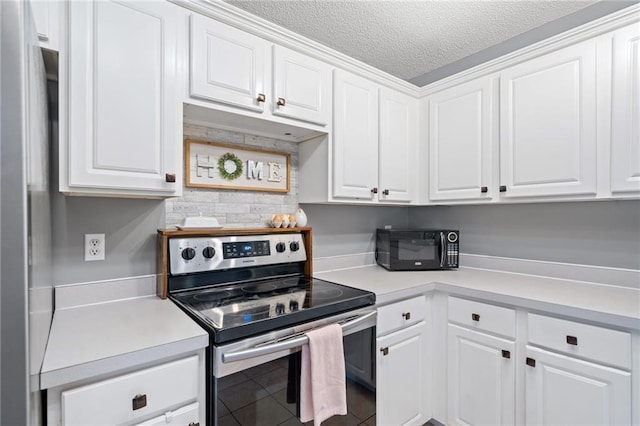 173 Cline Smith Rd NE, Cartersville, GA 30121 - kitchen featuring electric range, white cabinetry, light countertops, a textured ceiling, and tile patterned floors