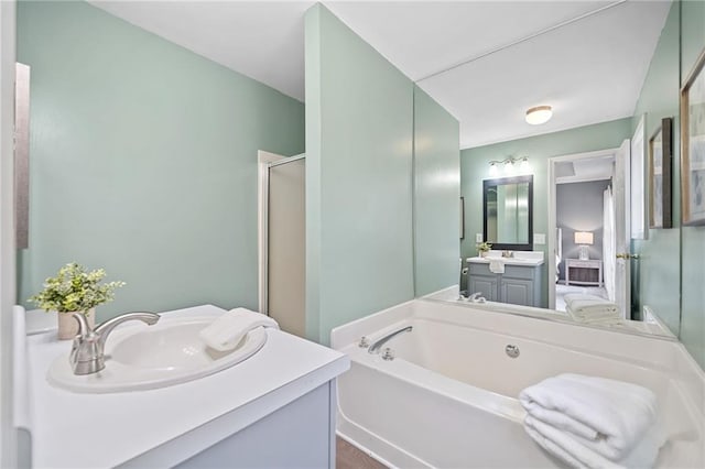 173 Cline Smith Rd NE, Cartersville, GA 30121 - full bathroom with a garden tub, a shower stall, vanity, and wood finished floors