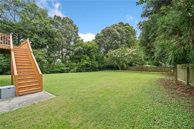 173 Cline Smith Rd NE, Cartersville, GA 30121 - view of yard featuring stairway, a wooden deck, and view of wooded area