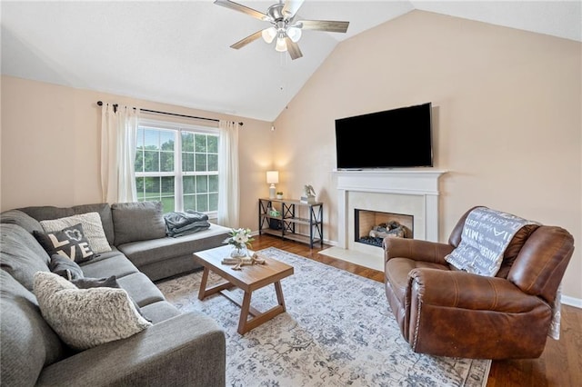 173 Cline Smith Rd NE, Cartersville, GA 30121 - living room with lofted ceiling, a ceiling fan, wood finished floors, and a fireplace with flush hearth