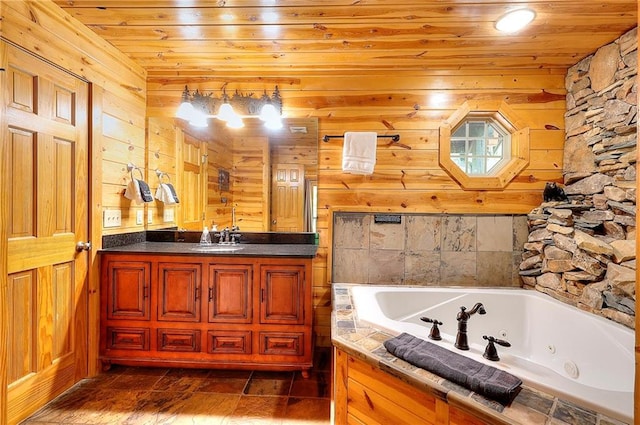 full bath with wood ceiling, wooden walls, vanity, and a jetted tub