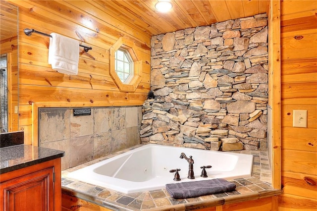 full bath with a tub with jets, vanity, and wood ceiling