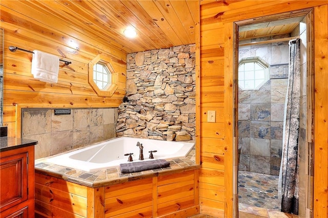 bathroom featuring wooden ceiling, tiled shower, and a bath