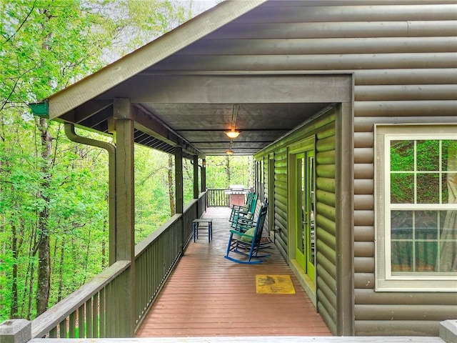 wooden deck featuring covered porch
