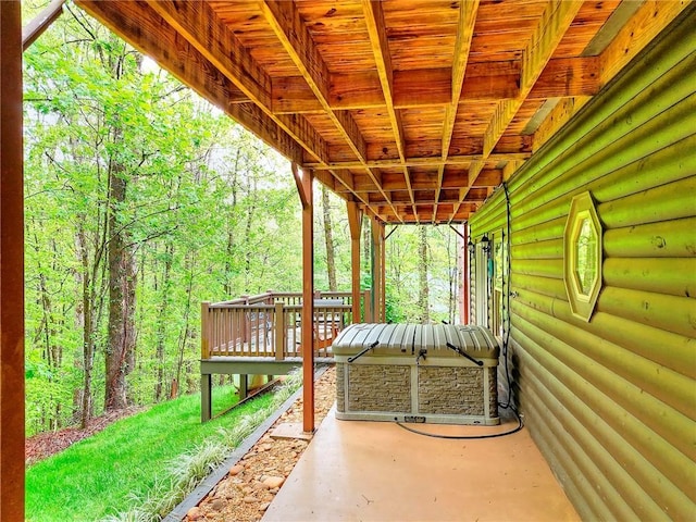 view of patio / terrace with a forest view