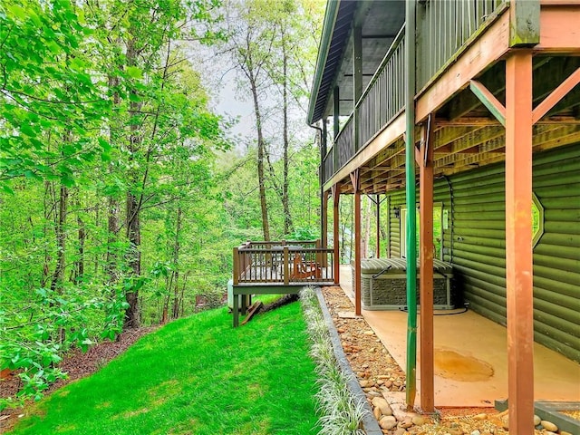 view of yard with a wooden deck and a patio area