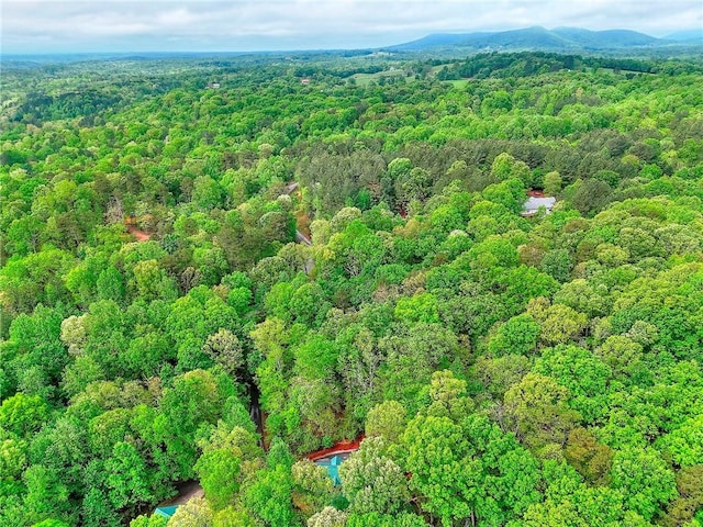 aerial view featuring a view of trees