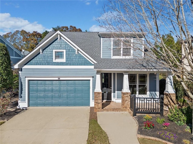 view of front facade featuring covered porch and a garage