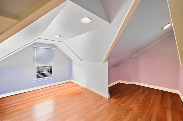 bonus room featuring hardwood / wood-style flooring and lofted ceiling