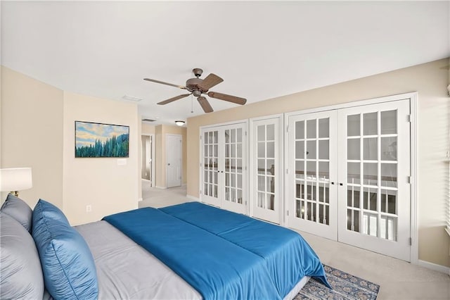 bedroom with french doors, light colored carpet, and ceiling fan