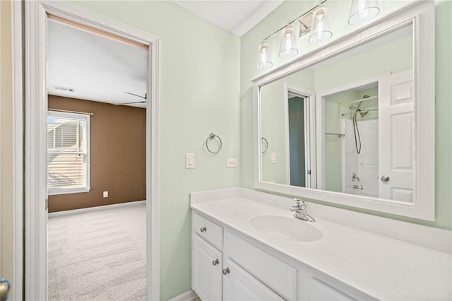 bathroom featuring vanity,  shower combination, and ceiling fan