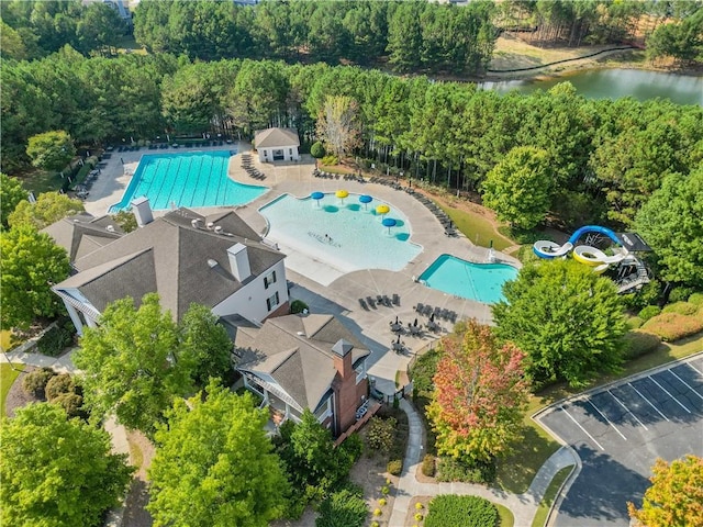 birds eye view of property with a water view