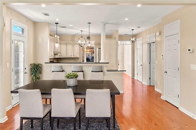 dining room with light hardwood / wood-style flooring