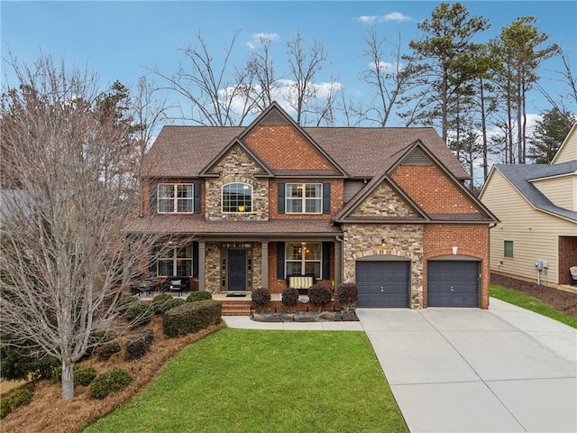 craftsman inspired home featuring covered porch and a front lawn