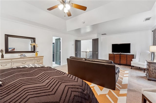 carpeted bedroom with ceiling fan and ornamental molding