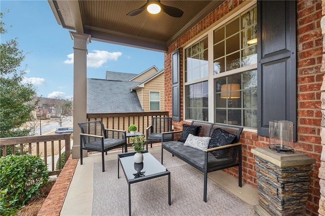 balcony with ceiling fan, a porch, and an outdoor hangout area