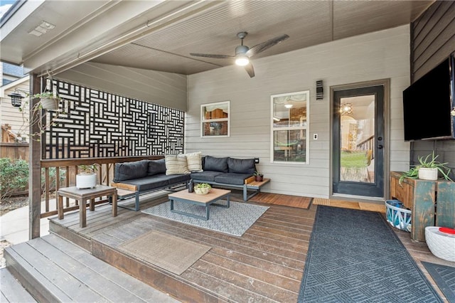 wooden terrace featuring an outdoor hangout area and ceiling fan