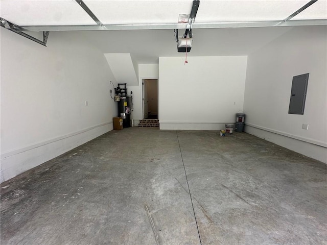 garage featuring electric panel, water heater, and a garage door opener