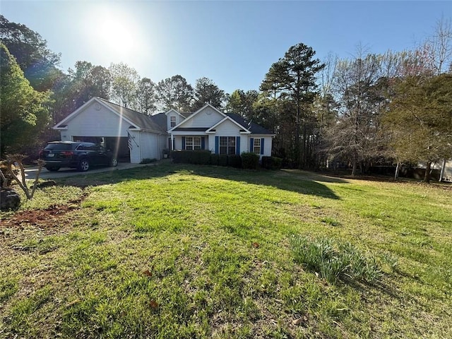 ranch-style home featuring a garage and a front lawn