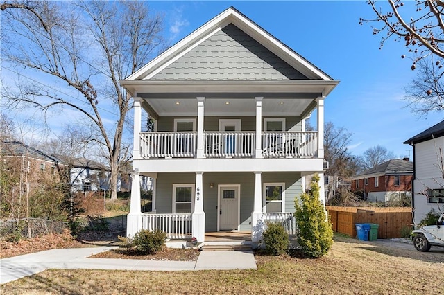 view of front of property featuring a porch and a balcony