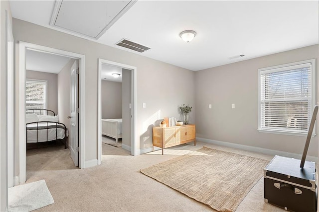 bedroom featuring light colored carpet