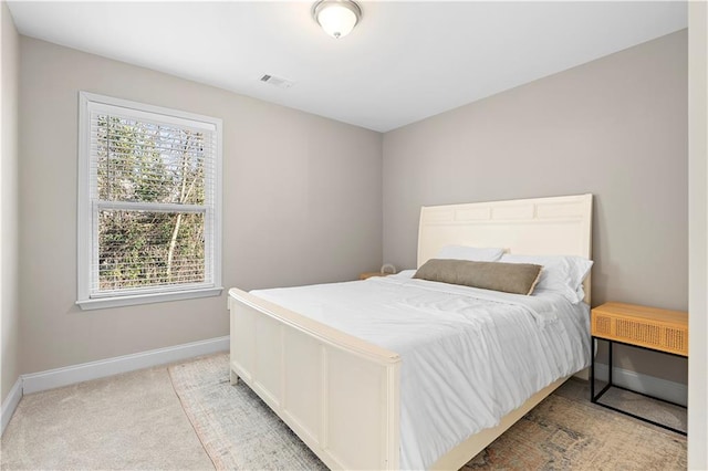 bedroom featuring light colored carpet