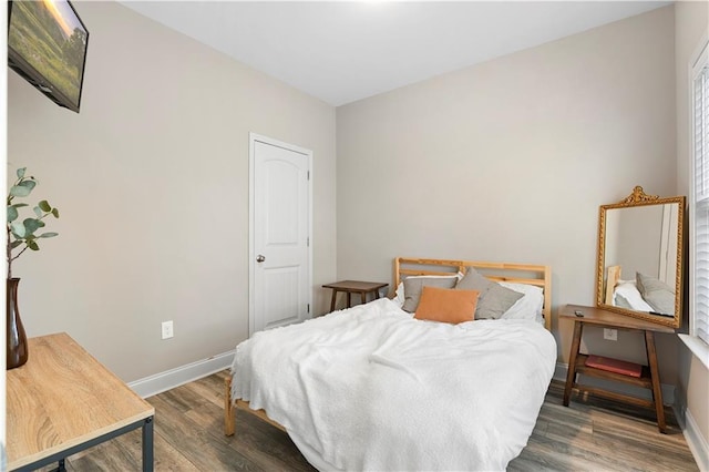 bedroom with hardwood / wood-style flooring